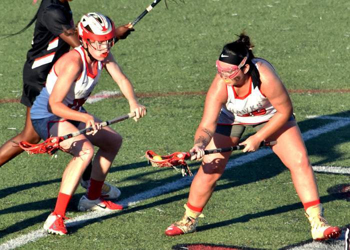Kaylee Andrews (right) had two goals, an assist an seven draw controls in Tuesday's win over LaGrange.